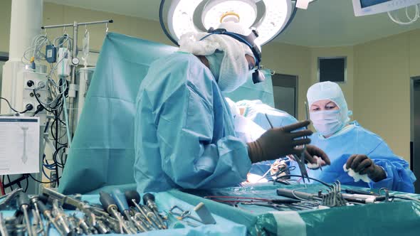 Surgical Procedure is Getting Done By a Group of Doctors alt