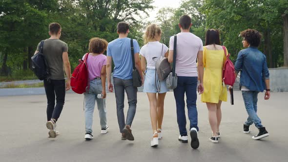 Group of Students Walking Together Outside alt