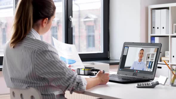 Woman with Laptop Having Video Call at Office