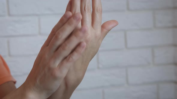 Woman Rubbing Hand Cream. alt