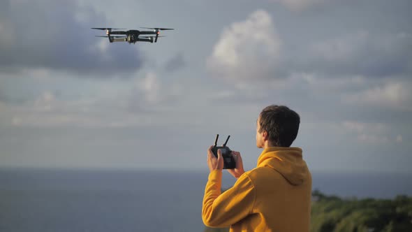 Man Traveler Takes Photos or Video Using Drone