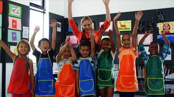 Portrait of teacher and schoolkids having fun alt