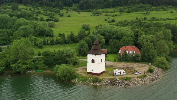 Aerial view of the church on the Liptovska Mara reservoir in Slovakia alt