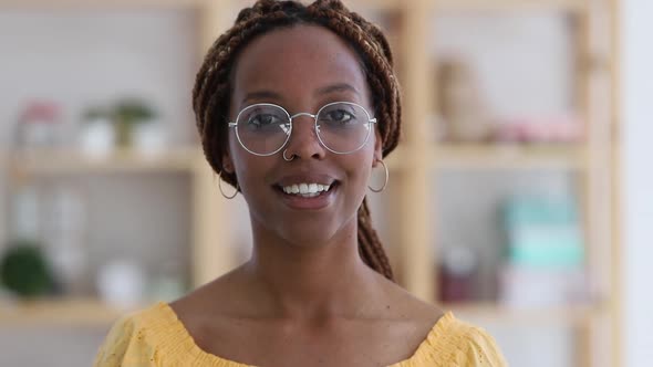 Afro Woman with Glasses Standing in Modern Living Room and Smiling Portrait Spbi alt