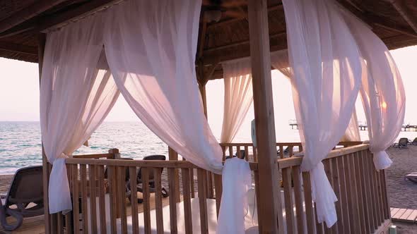 Romantic Beach Canopy at Sunset. alt