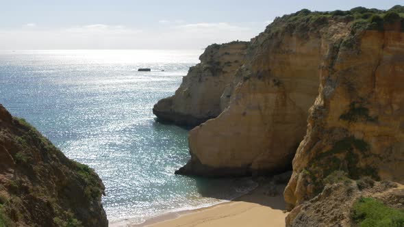 Rocks and cliff on a sea shore alt