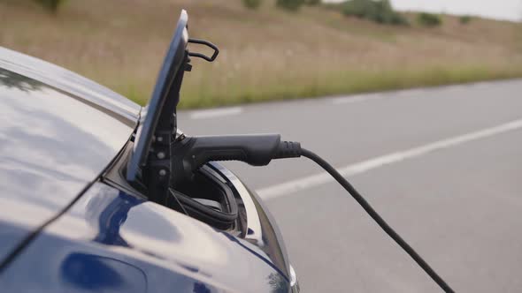 Close Up View of a Girl That Wants to Pull Out Charger alt