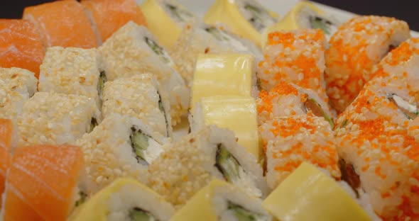 Large Selection Of Sushi Laid Out On A Platter. Japanese Cuisine