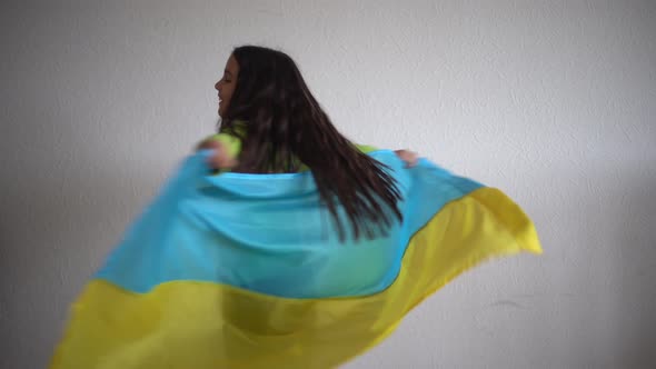 Little Girl Holding the Flag of Ukraine