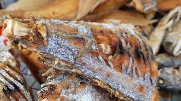 Different Kinds Of Deep Fried Fresh Fish Displaying On The Tray alt