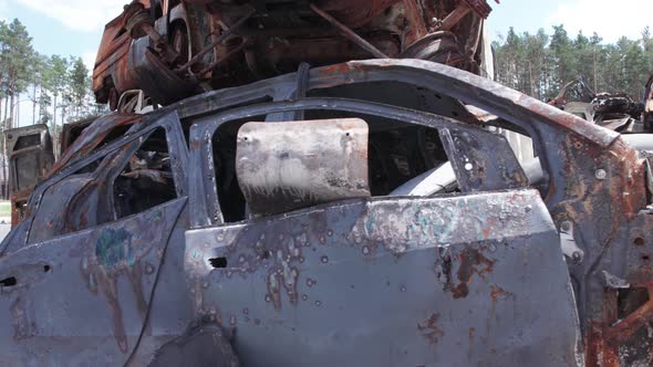 War in Ukraine a Dump of Shot and Burned Cars in Irpin Bucha District alt