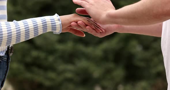 Close up man holding black female hands, demonstrating support. alt