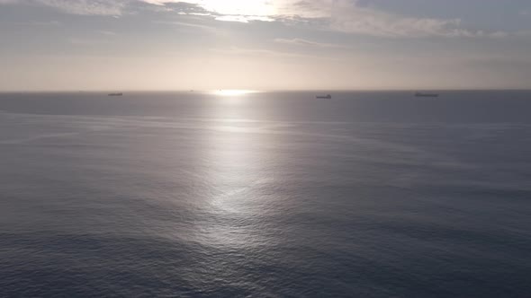 Aerial View of Ocean with Ships Seen in Horizon