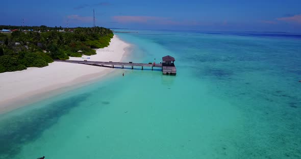 Wide angle drone copy space shot of a sandy white paradise beach and aqua blue ocean background in b alt