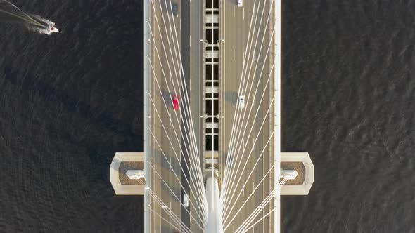 Aerial Top View of Cable-stayed Bridge with Cars alt