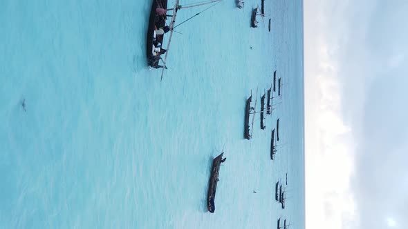 Tanzania Vertical Video  Boat Boats in the Ocean Near the Coast of Zanzibar Aerial View alt