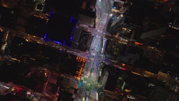 Aerial Birds Eye Overhead Top Down View of Glowing Colourful Light on Times Square alt