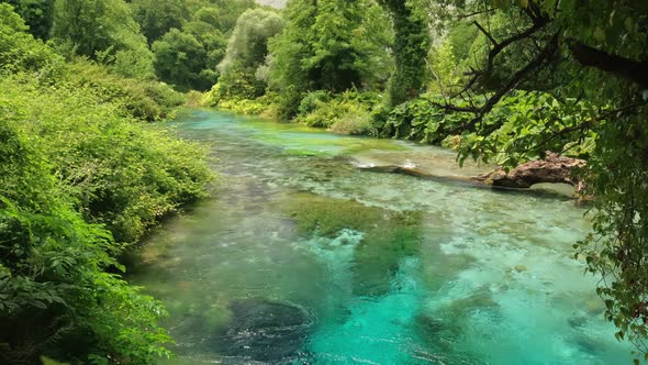 Beautiful Turquoise Spring Blue Eye or Syri i Kalter Near Muzine Town in Albania alt