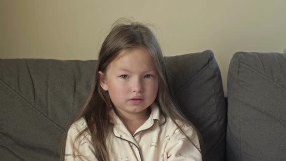 Portrait of an Angry Girl 67 Years Old After Sleep in Pajamas alt