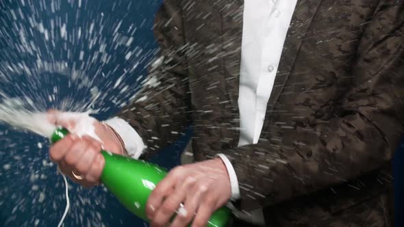 Male Hands Opening the Champagne Bottle alt