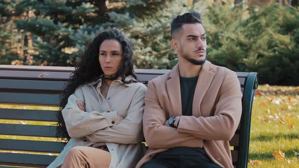 Sullen Couple Sitting on Bench in Park Man and Woman Sit with Arms Crossed Lovers Quarrel Ignoring alt