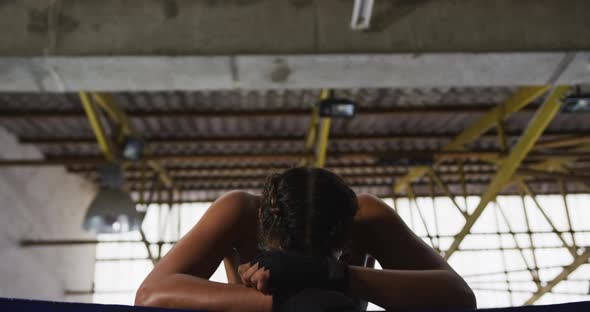 Woman resting after working out in voxing club alt