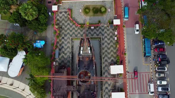 Aerial top down shot of giant sailing boat from the asian war monument in Melaka city. alt