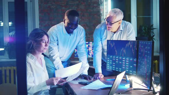 A Group of Brokers are Discussing Stock Market Reports alt