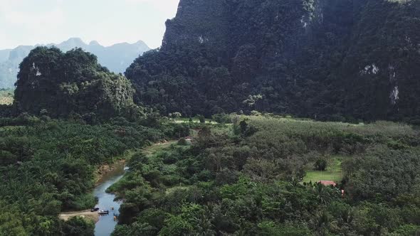 Aerial View Drone Shot of Beautiful River with Natural Scenery in Forest and High Mountains Thailand