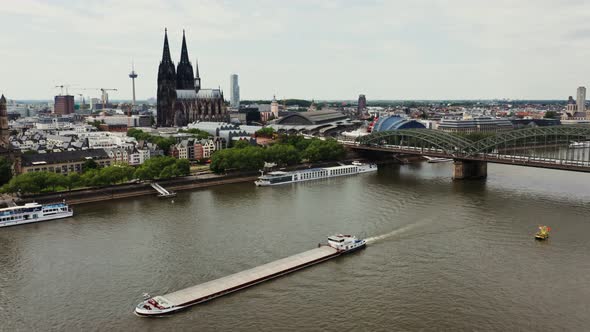 A Large Ferry Floats Along the Rhine River Through Historic Center of Cologne alt