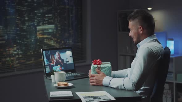 Young Mixed Race Man Discussing with Blonde Woman Exchanged Gifts By Video Call on Computer