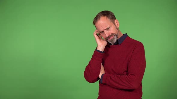 A Middleaged Handsome Caucasian Man Yawns and Acts Tired  Green Screen Background