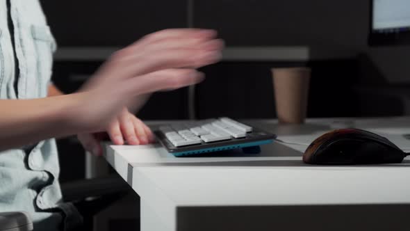 Cropped Shot of a Man Getting in His Chair in Front of Computer and Starting Work alt