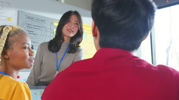 Meeting of UX developer and UI designer brainstorming about mobile app interface alt