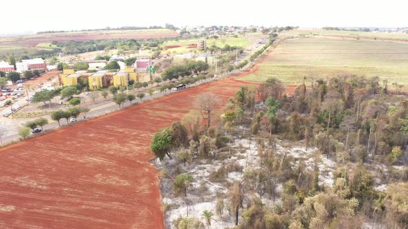 City and burnt vegetation in Campinas, Sao Paulo,  drone shot alt