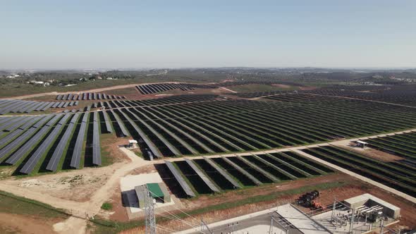 Solar panels for photovoltaic system at Lagos in Portugal. Aerial backward ascending and sky for cop