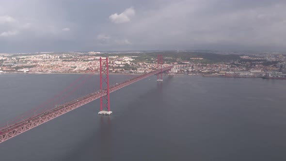 Aerial of 25 de Abril Bridge and Christ the King sculpture