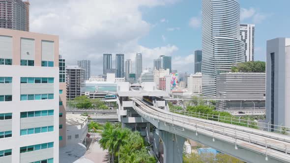 Fly Over Metromover Track Leading on Columns Above Park alt