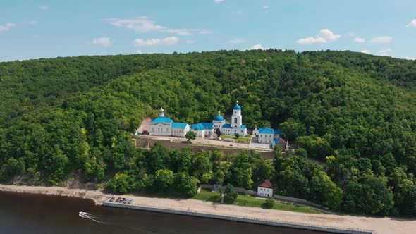 Makaryev Monastery in Russia Surrounded By Green Forest Placed Near the River alt