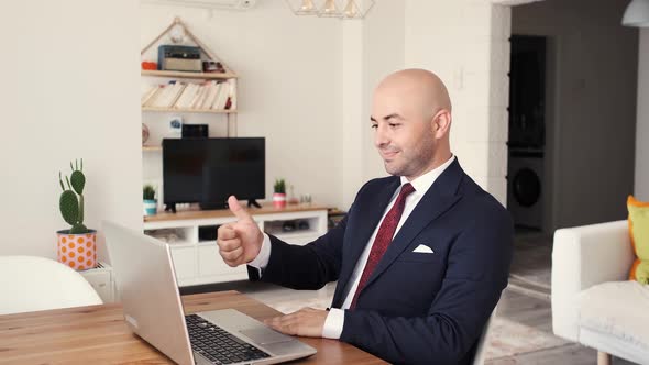 Businessman approving at online meeting. home office manager confirms.	