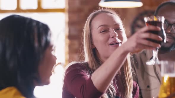 Caucasian girl wishing all the best to her friend in the bar