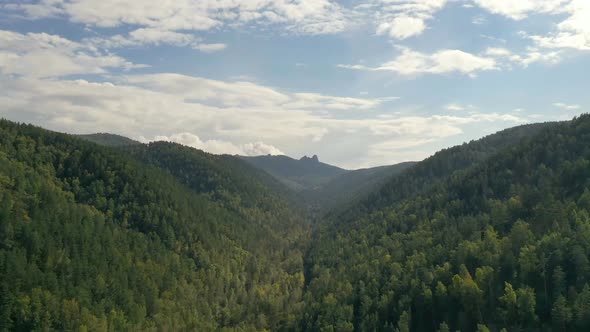 Flying in a Mountain Gorge Over an Autumn Forest Hyperlapse