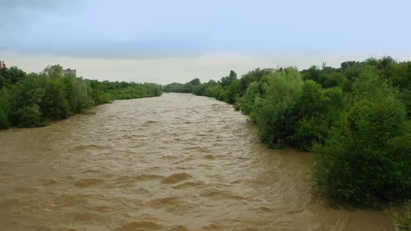Aerial Drone View. Rriver Water Big and Dirty After Heavy Rain. Slow Motion. alt