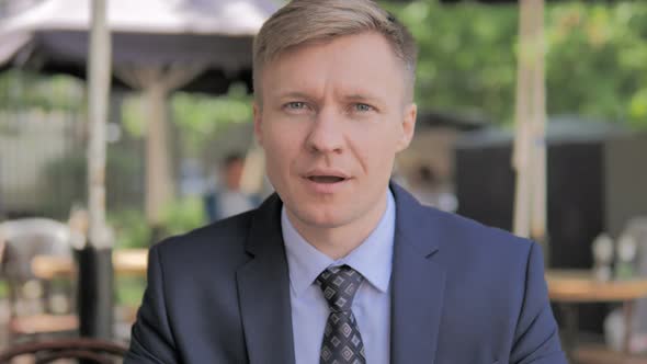 Outdoor Portrait of Amazed Businessman, Surprised alt