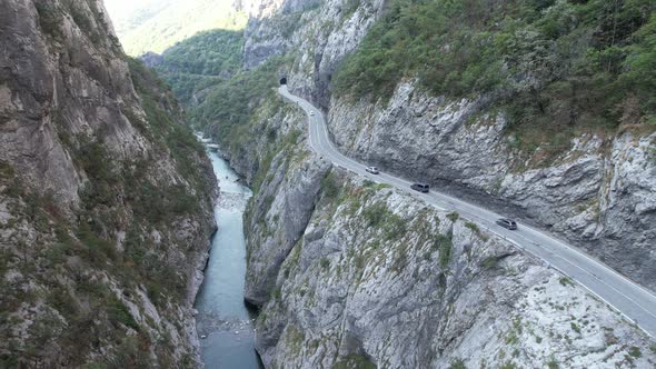 Aerial view of Tara river canyon, big mountains and road Montenegro, Europe alt