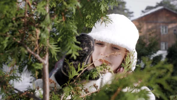 Beautiful Teenage Girl Smiling at Camera Outdoors at Wintertime alt