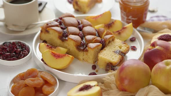 Delicious Homemade Peach or Nectarine Cake Fresh Fruits Marmalade Cranberry on Stone Background alt