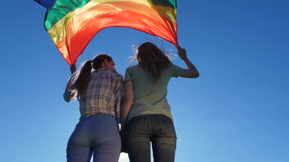 Young Lesbians With Flag Standing Back Outdoor By Stusya VideoHive