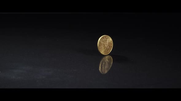 Spinning coin on a reflective surface - MONEY 0048 alt