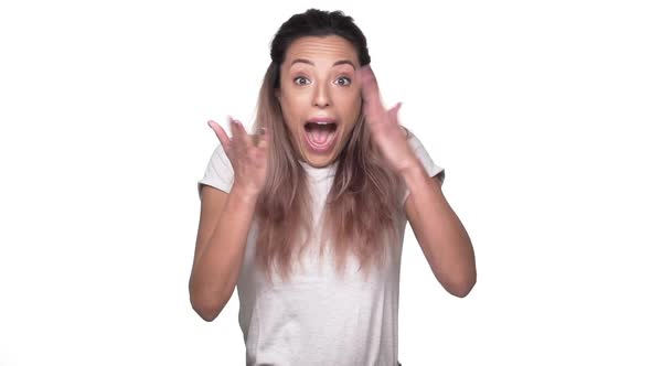 Portrait of Fabulous Adult Woman with Dyed Hair Happily Gesturing and Rejoicing Good News Over White alt